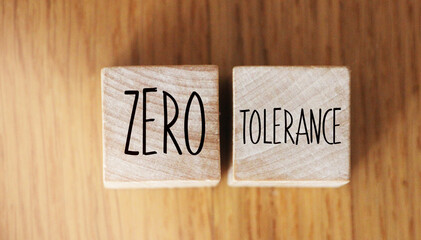 Zero tolerance - words from wooden blocks with letters, severely punishing all unacceptable...