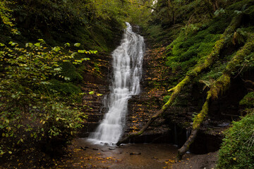 Fototapeta na wymiar The strangely named Water-Break-its-Neck waterfall in the Warren Wood area of Radnor Forest in Mid Wales, UK 