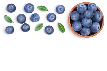 fresh ripe blueberry in wooden bowl isolated on white background with clipping path . Top view with copy space for your text. Flat lay