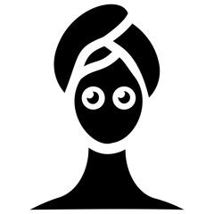 
Woman head wrapped in towel taking facial massage from two hands on sides 
