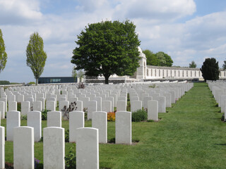 British and Commonwealth WW1 graves, Tyne Cot Cemetery, Belgium, with visitor centre and memorial wall to the missing in background