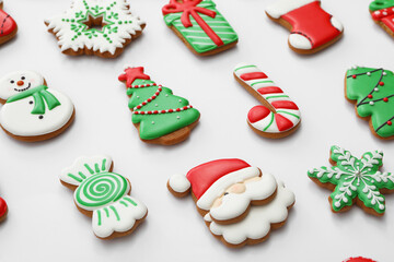 Different Christmas gingerbread cookies on white background, closeup