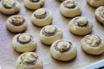 Homemade mushroom-shaped cookies on parchment paper. Shortbread.