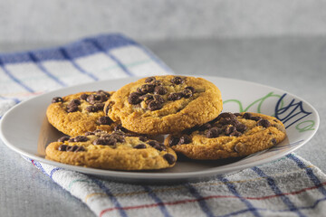 Homemade cookies with chocolate on white plane