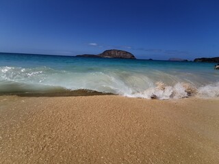 Dream beach, longing for vacation. Take a break. Blue beach, fine sand, clear water, waves