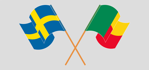 Crossed and waving flags of Benin and Sweden