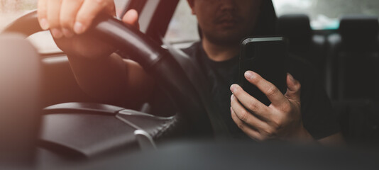 Asian man video calling via smart mobile phone inside a car, close up. People lifestyle, social media communication concept.