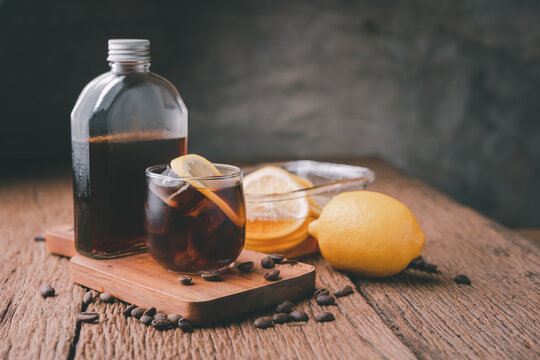cold brew coffee. lemon spiced cold brew coffee on a wooden table