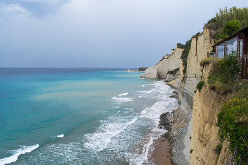 Obraz premium Limestone cliffs on the northwestern shore of Corfu Island, Greece, as seen from Logas the Sunset beach viewpoint