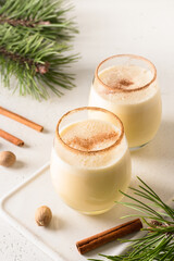 Traditional Christmas eggnog with grated nutmeg and cinnamon. Close up.