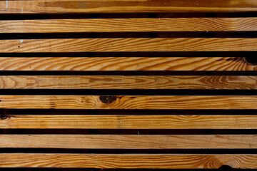 Background from a lattice from yellow wooden boards.
