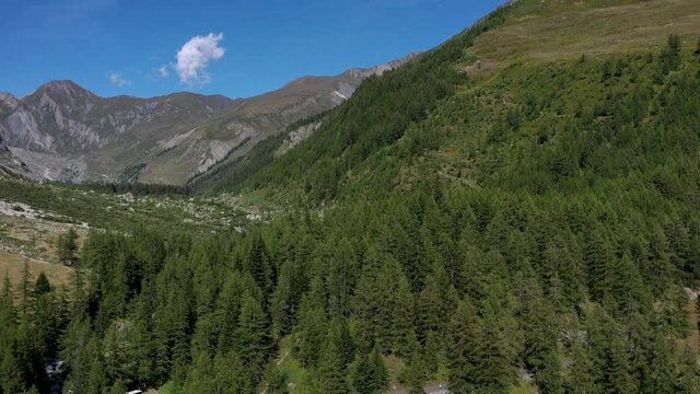 Val Ferret Departing from the Col Ferret on the Border Between Italy and Switzerland. Southern and Eastern Sides of the Mont Blanc Massif. Aerial Summer Time Footage