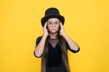 All you need is change. Fashion look of little girl. Small child look through glasses yellow background. Beauty salon. Trendy accessory. Going out outfit and party clothes