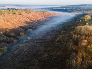 Aerial view to foggy valley autumn season