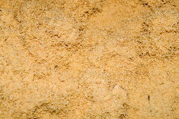 Dry wood shavings background. Wood dust texture. Sawdust pattern closeup. Sawdust floor texture. Top view. Sawdust close up . Wood industry concept. Eco energy design