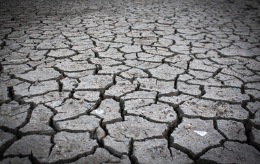 Dried land suffering from drought. Crackled clay texture