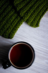 a cup of tea on a light wooden background