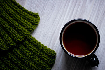 a cup of tea on a light wooden background