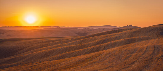 Sunrise over Tuscany hills in Crete Senesi
