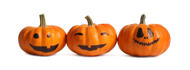 Halloween pumpkins with cute drawn faces on white background