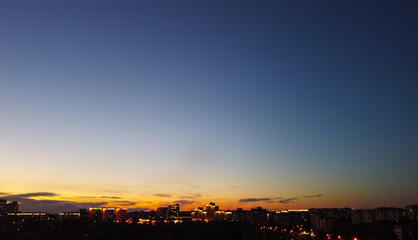 Dark blue sunset sky over night city for background
