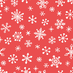 Vector seamless pattern of snowing, hand drawn snowflakes. Simple design for Christmas wrappings, textile and backgrounds