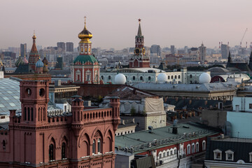 Fototapeta premium Cityscape view from the roof of the Central Children's store at Lubyanka in the center of Moscow. There you can see landmarks of the Moscow downtown: Kremlin, Spasskaya tower, St. Basil's Cathedral.
