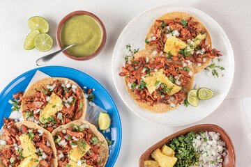 Traditional Mexican tacos called Al Pastor
Authentic seasoned pork tacos served with sliced pineapple

