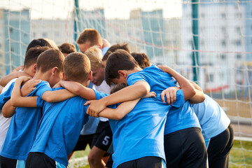 portrait of friendly football team gathered together, tune in the right way, they advise how to play