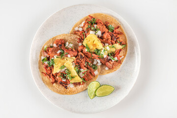 Traditional Mexican tacos called Al Pastor
Authentic seasoned pork tacos served with sliced pineapple

