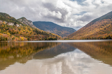 Beautiful lake in front of the the mountains in the fall in New England
