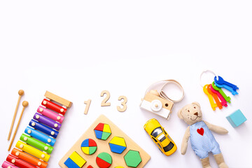 Obraz premium Colorful kids toys on white background. Top view, flat lay.