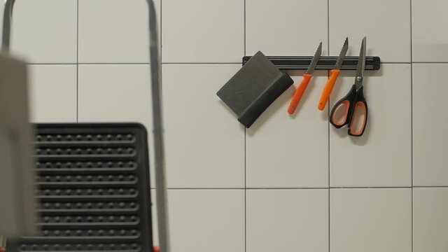 Kitchen knives set on the white wall