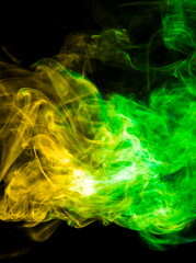 Colored smoke on black background