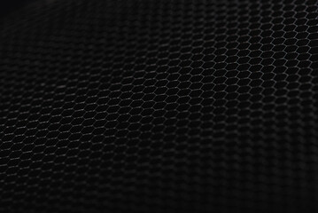 Panorama of black iron, plastic hexagonal texture. Industrial mesh background. Low key with...