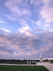 Fototapeta na wymiar Beautiful purple sunset and square with obelisk
