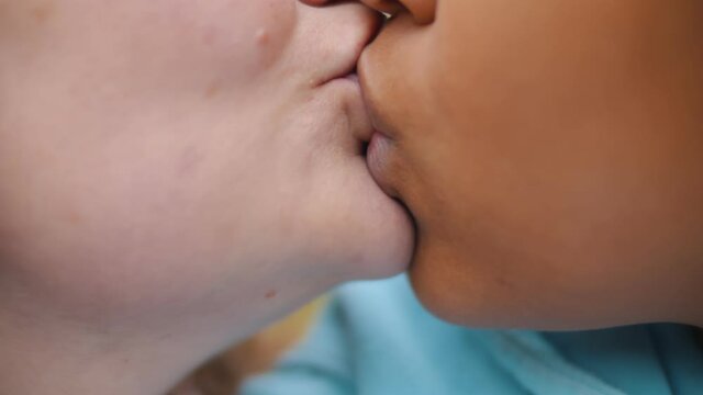 Close up of multiethnic lesbian couple passionately kissing