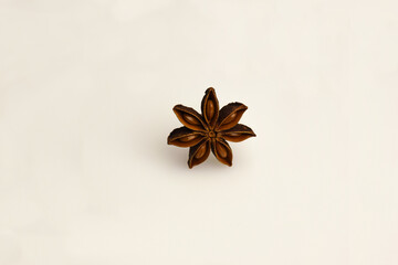 The star anise on a white clipping background lies in the middle of the frame. Close-up...