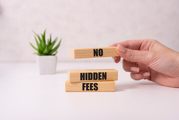 No hidden fees word written on wood block. Taxes and fees Financial business concept.