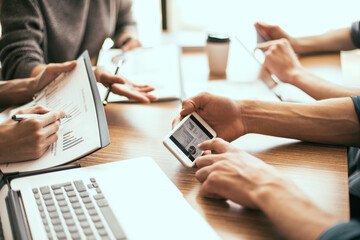 close up. working group analyzing financial statistics.