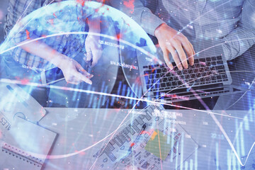 Multi exposure of man and woman working together and forex graph hologram drawing. Financial analysis concept. Computer background. Top View.