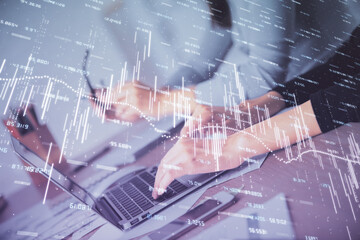 Fototapeta na wymiar Multi exposure of woman hands typing on computer and financial chart hologram drawing. Stock market analysis concept.