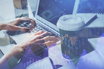 Double exposure of woman hands typing on computer and forex chart hologram drawing. Stock market invest concept.