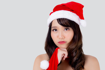 Beautiful portrait young asian woman Santa costume wear hat smiling and thinking in holiday xmas, beauty model asia girl cheerful and happiness celebrating in Christmas isolated on white background.