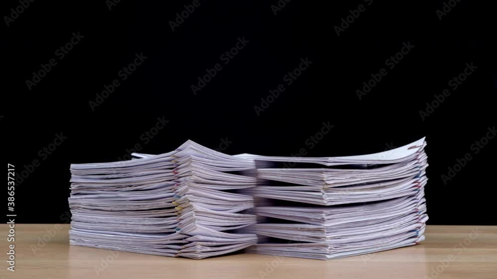 Aufkleber stop motion animation stacks overload document paper files on office desk isolated on black backgrou