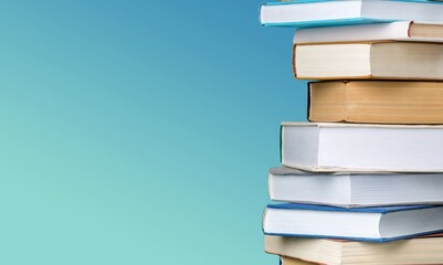 Collection of old books stack on blue background