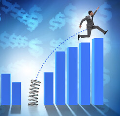 Business people jumping over bar charts