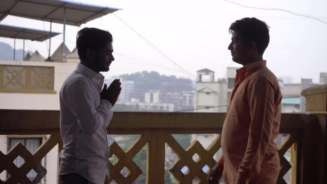 town mens in formal saying no to hand shake new normal namaste