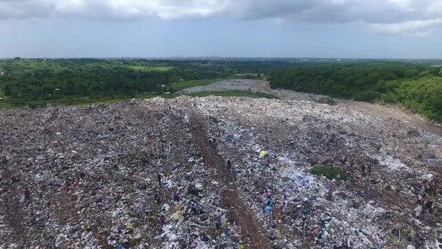 Aerial view over huge pile of garbage in Duquesa landfill. Santo Domingo