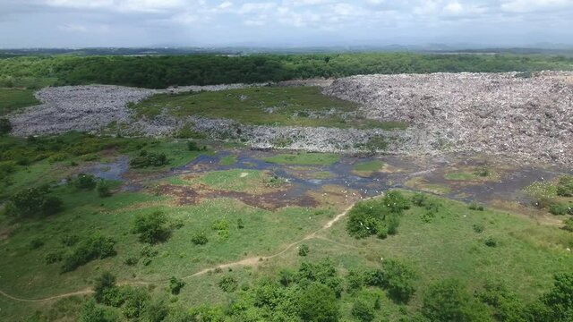 Duquesa landfill and surrounding landscape in Santo Domingo. Aerial circling
